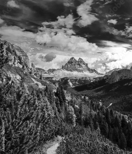 Dynamic surreal clouds running over the Tre Cime di Lavaredo, in the Italian Alps black and white