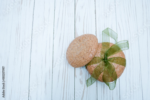 almond biscuits bandaged with green ribbon as a gift