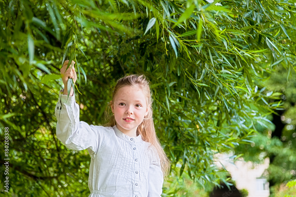 Girl walks in the summer in the Park among the trees Girl walks in the summer in the Park among the trees