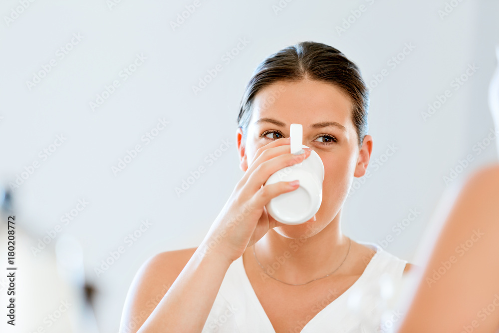 Young woman with her friend having tea at home Young woman with her friend having tea at home