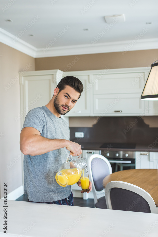 man pouring orange juice man pouring orange juice