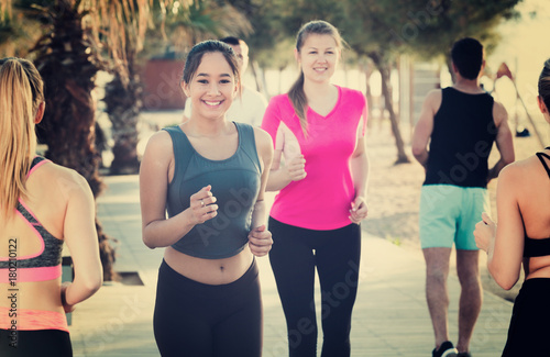 People jogging on city seafront