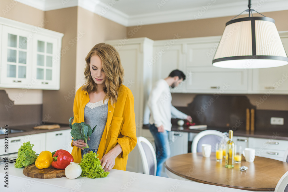 couple preparing vegetables