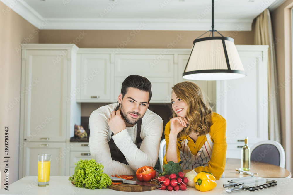 Couple preparing vegetables Couple preparing vegetables
