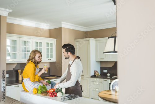 Couple preparing vegetables