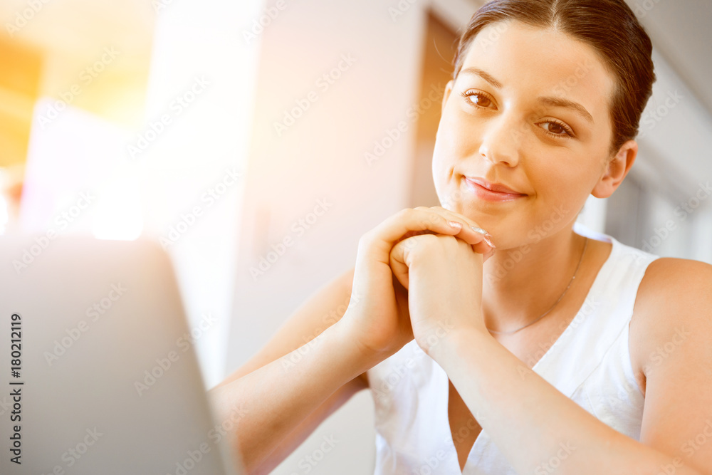 Young beautiful woman working on her laptop