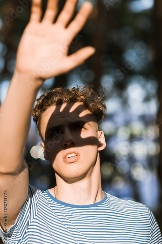 Dazzled sunlight handsome man nature concept. Traveler lifestyle. Alone with problems. Blind path.