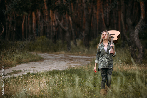 Pretty woman guitar nature fashion look concept. Unity with nature. Music in heart. © Photodrive