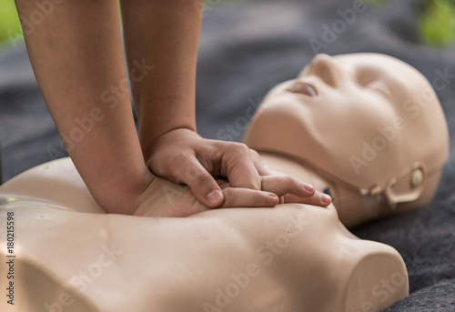 Cpr training outdoors. Reanimation procedure on CPR doll photo