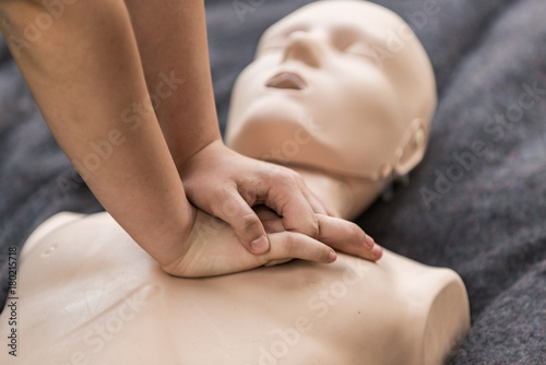 Cpr training outdoors. Reanimation procedure on CPR doll photo
