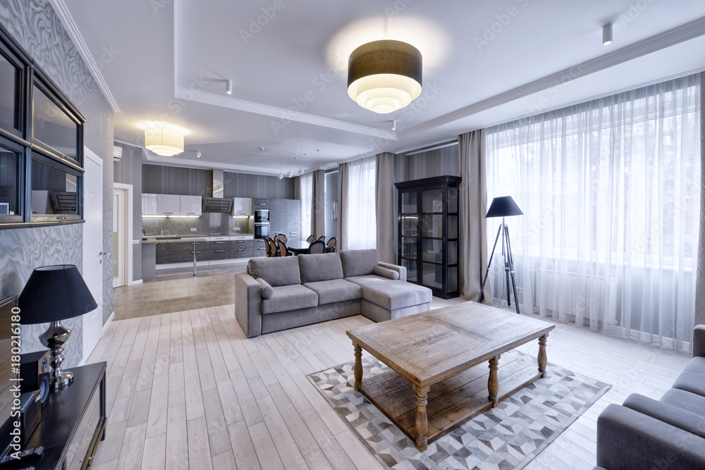 Interior of the kitchen-living room in a modern house. Interior of the kitchen-living room in a modern house.
