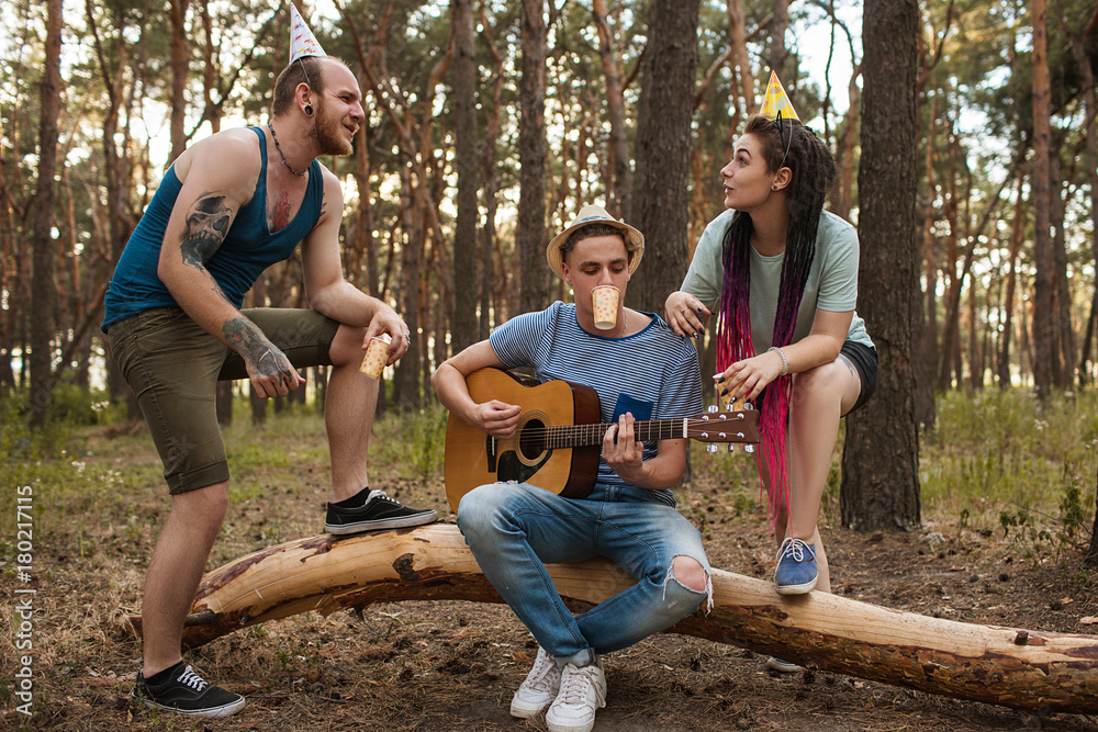 Fototapeta premium Friends guitar song picnic party nature concept. Traveler lifestyle. Hiking happy moments.