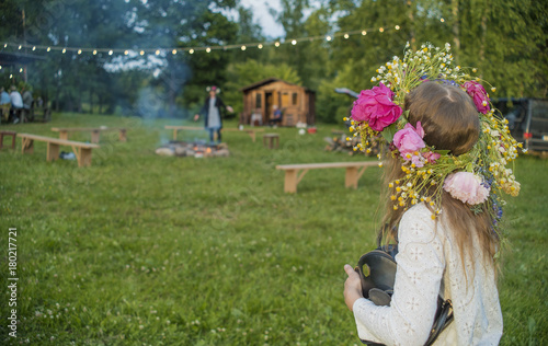 Girl with flower crown at Midsummer celebration