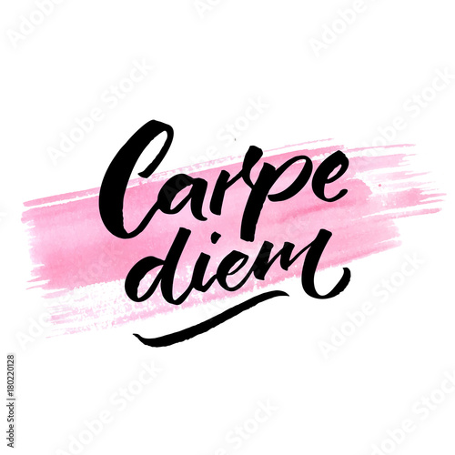 Carpe diem - latin phrase means seize the day, enjoy the moment. Inspiration quote brush calligraphy handwritten on pink watercolor stroke. photo