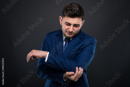 Businessman suffers intense elbow pain