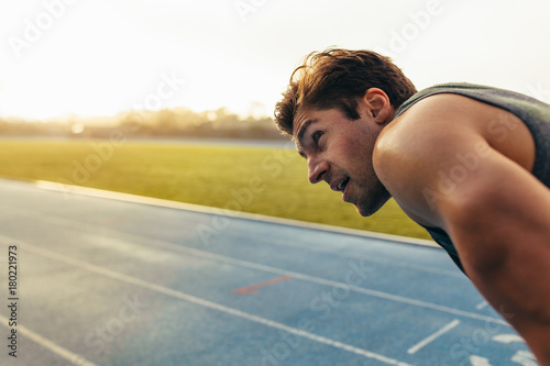 Plakat Sprinter standing on running track