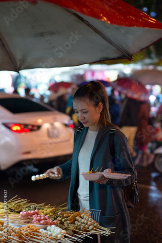 Buying Asian snacks © DragonImages