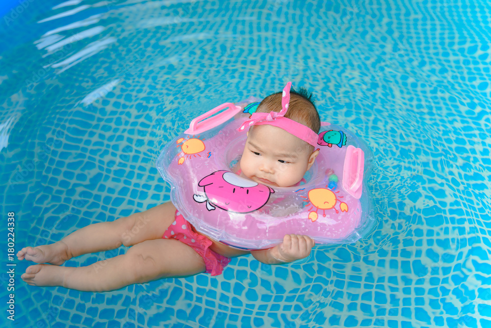 Littile girl swimming on the pool Littile girl swimming on the pool