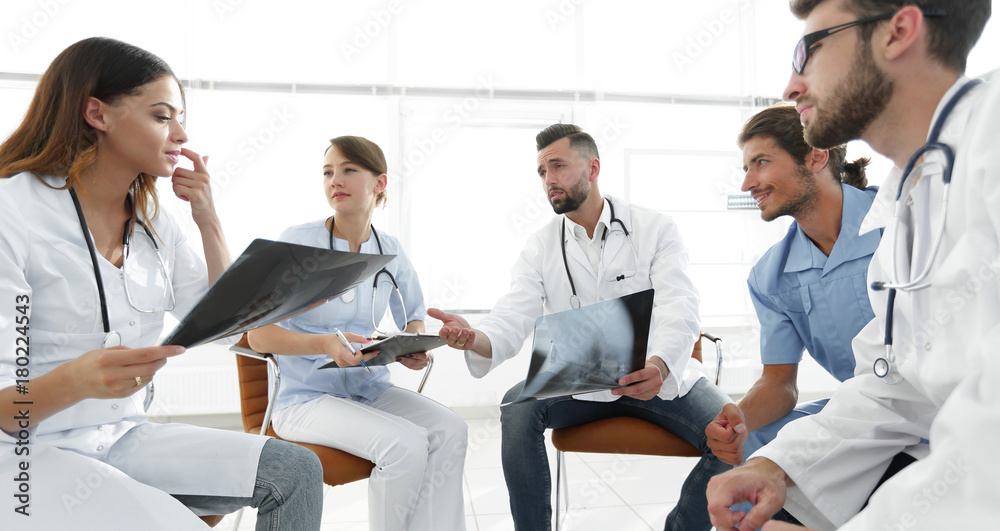 medical staff discussing x-ray of a patient medical staff discussing x-ray of a patient