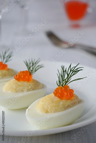 Stuffed eggs with caviar, cheese and mayonnaise
