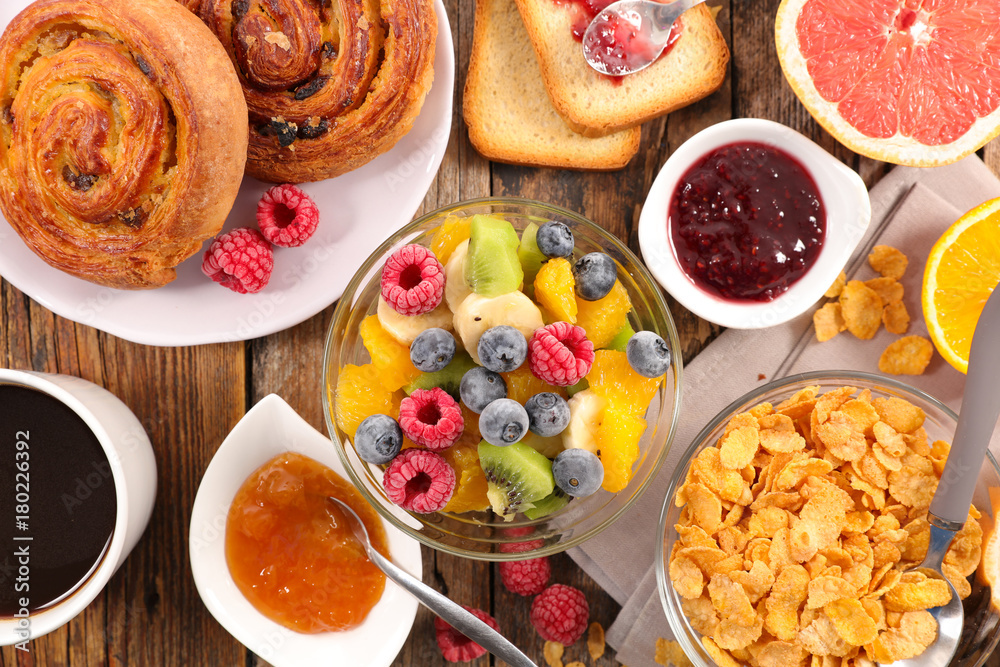 breakfast with fruit,croissant,cereal and coffee breakfast with fruit,croissant,cereal and coffee