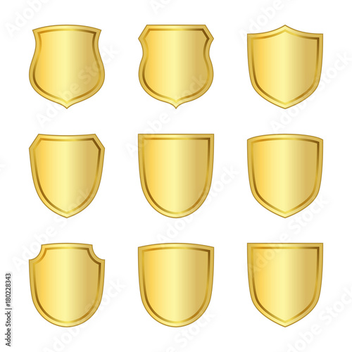 Gold shield shape icons set. 3D golden emblem signs isolated on white background. Symbol of security, power, protection. Badge shape shield graphic design Vector illustration