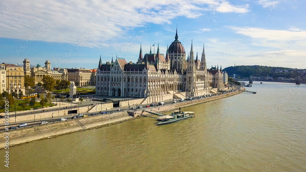 Fototapeta premium Aerial footage from a drone shows the historical Buda Castle near the Danube on Castle Hill in Budapest, Hungary. Bridge on the river. Aerial view.