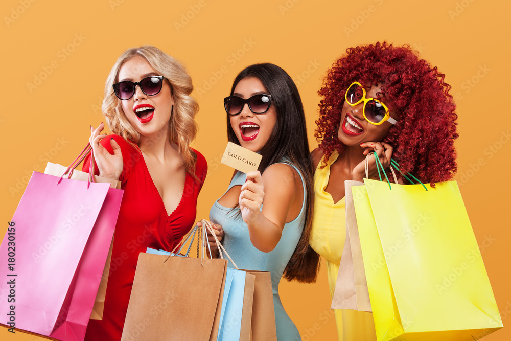 Double Eleven Shopping Festival . Three happy women in sunglasses after  shopping. Afro american, asian and caucasian races. Black friday holiday.  Concept for sale advertisement. Photos | Adobe Stock