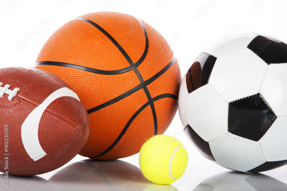 Assorted sports balls on white background