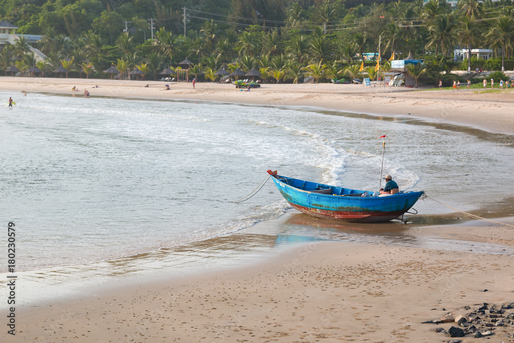 Traditional Vietnamese fishing coracles on beach, boats in fishing village Traditional Vietnamese fishing coracles on beach, boats in fishing village