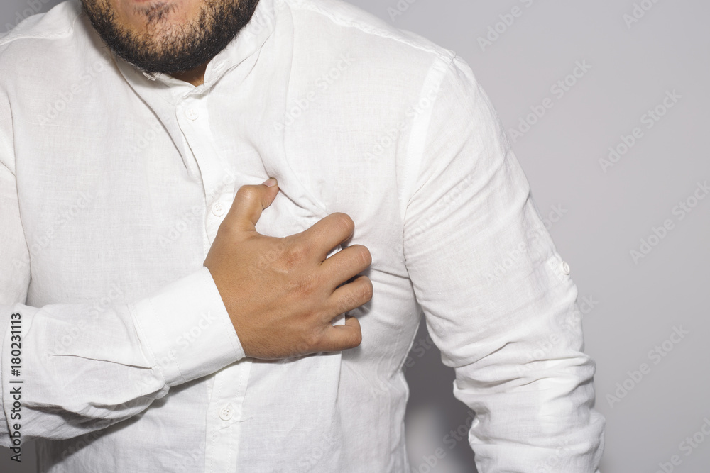 Man having a pain in the heart on white Man having a pain in the heart on white