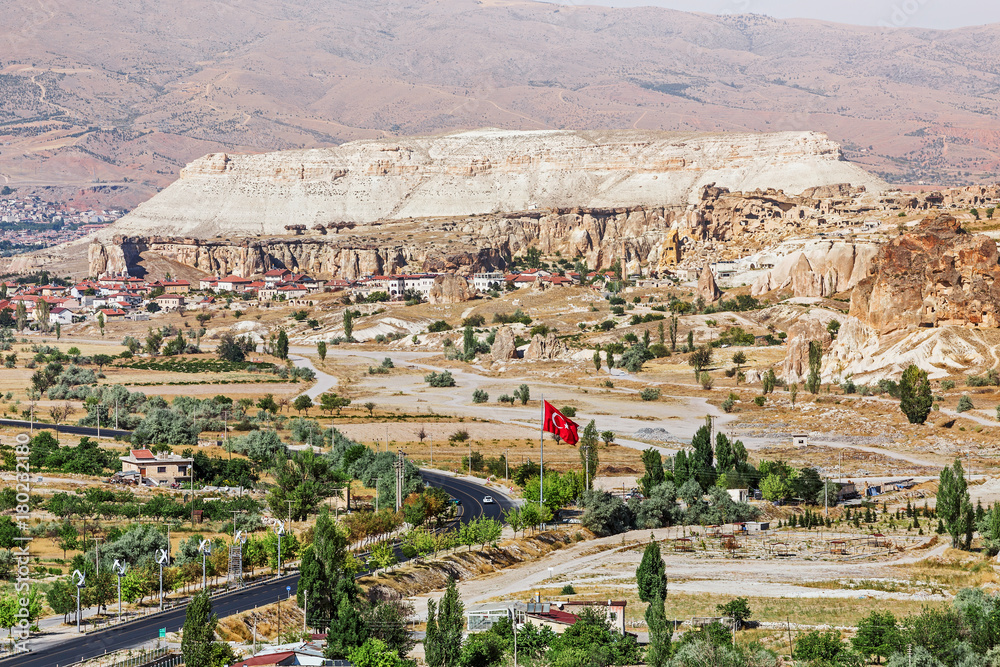 Turkish flag on the mountain in Cappadocia valley in Goreme national park