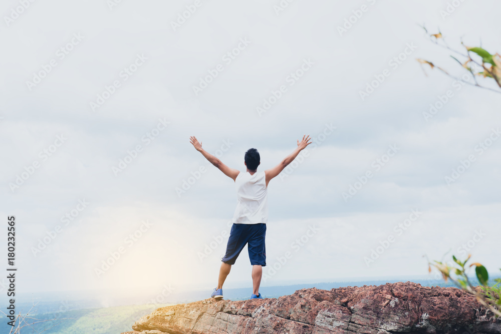 Handsome men climbing mission success, and he was glad his hand above his head.