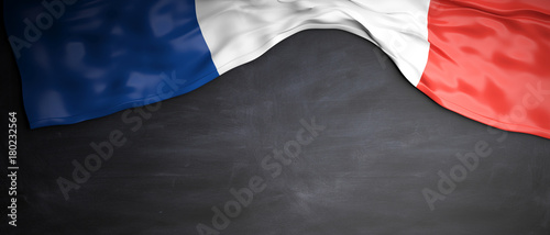 Photo France flag placed on blackboard background with copyspace