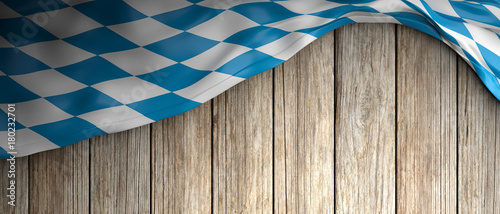 Bavaria flag for Oktoberfest. Wooden background with copyspace. 3d illustration