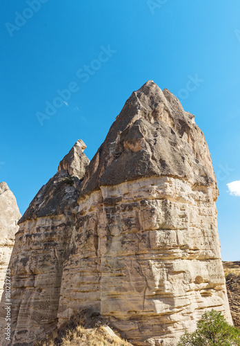 Volcanic tuff Rocks named fairy chimneys or mushrooms at sunset in Cappadocia, Turkey photo