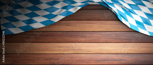 Bavaria flag for Oktoberfest. Wooden background with copyspace. 3d illustration