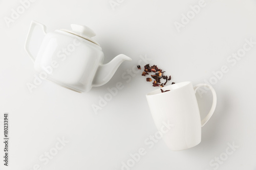tea pouring from pot into cup