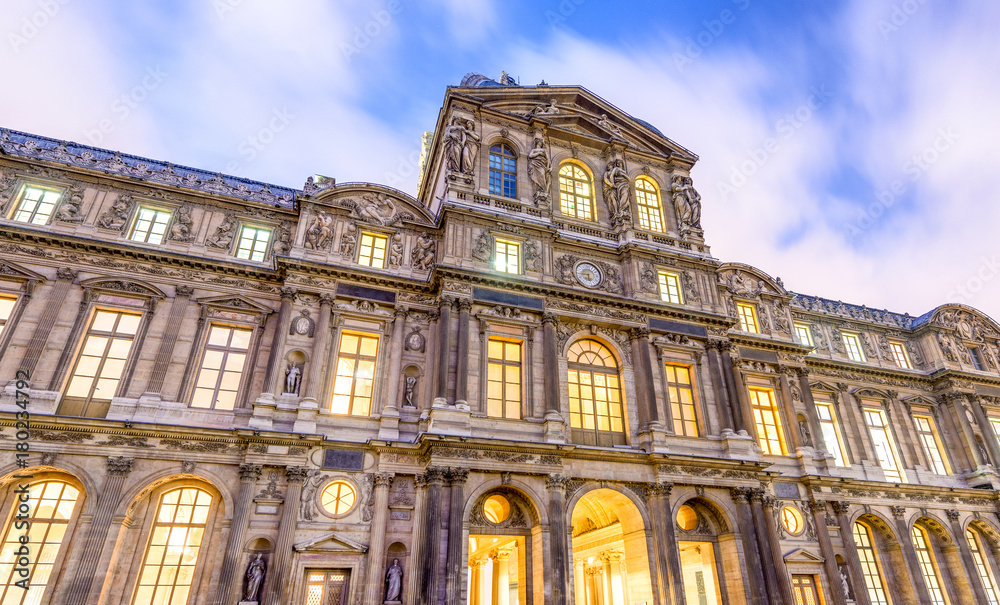 Fototapeta premium Exterior of Louvre buildings at night