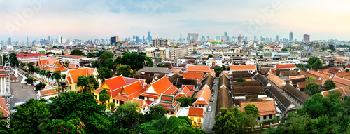 Panorama view of Bangkok from Golden Mountain on sunset cloudy sky, Thailand. Traditional architecture of Bangkok from the height of bird flight.