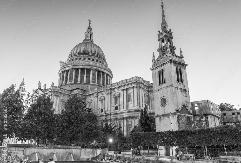 LONDON - JUNE 29, 2015: Tourists visit St Paul Cathedral at night. The city attracts 30 million people every year