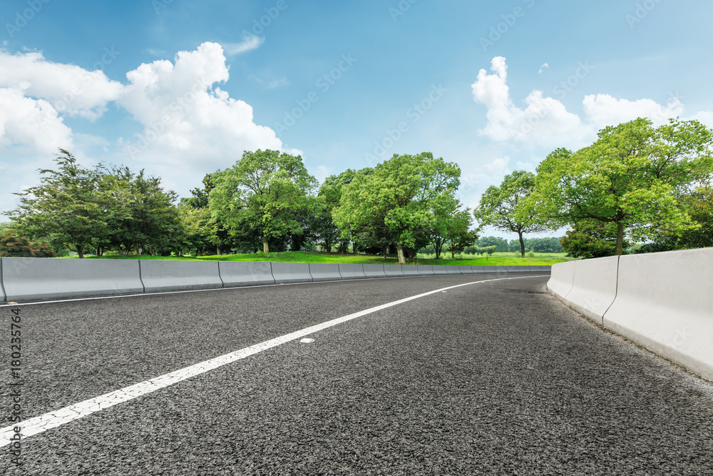 Asphalt highway and green forest nature landscape Asphalt highway and green forest nature landscape