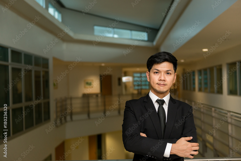 Fototapeta premium Portrait of Asian business man in the building in the evening