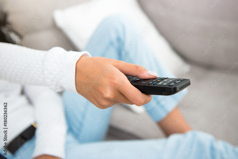 Girl with a television remote Girl with a television remote