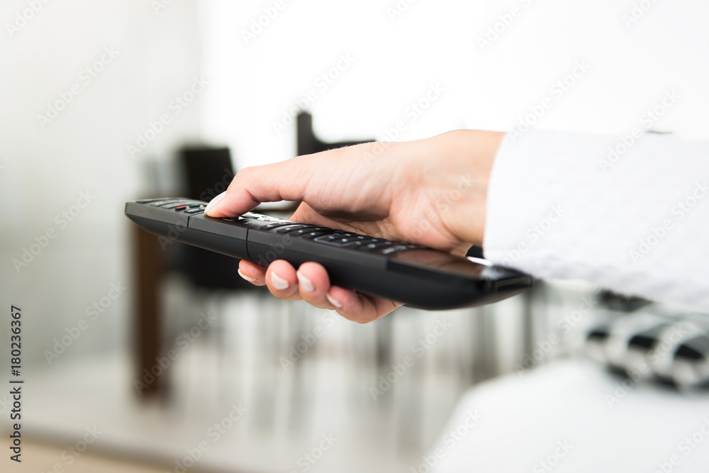 Girl with a television remote Girl with a television remote