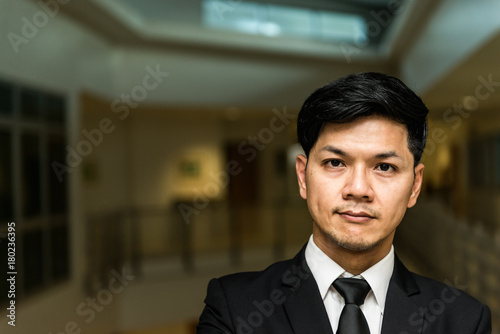Portrait of Asian business man in the building in the evening