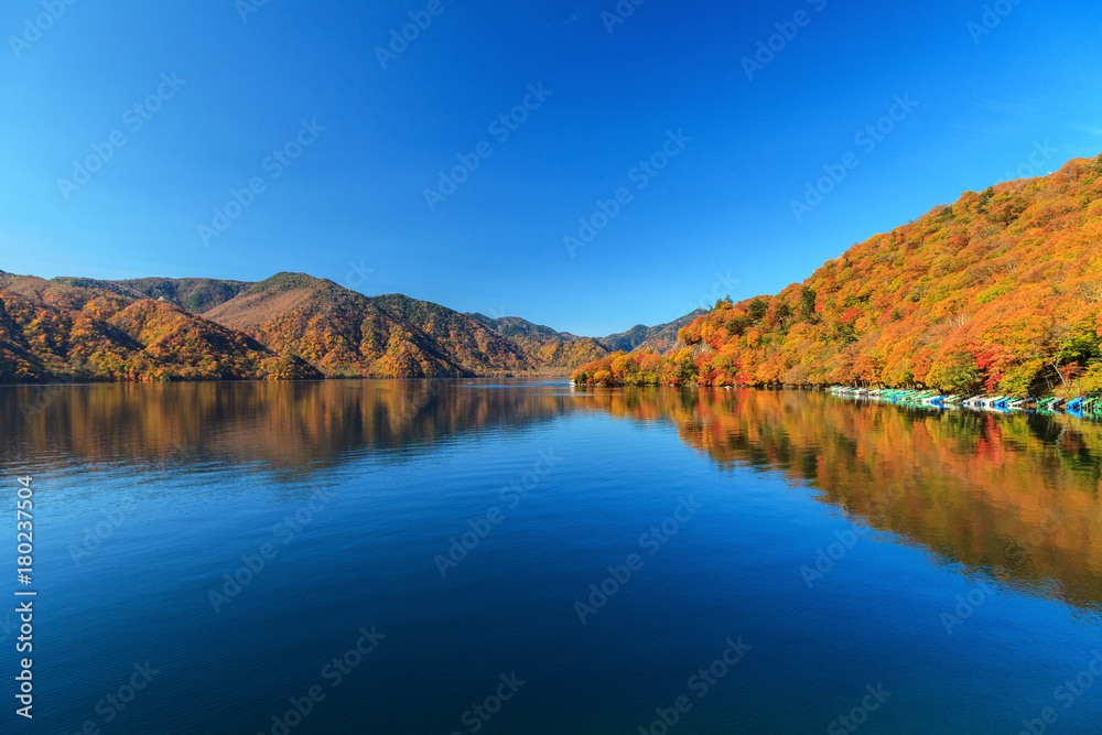 View of Chuzenji lake in autumn season with reflection water in Nikko, Japan