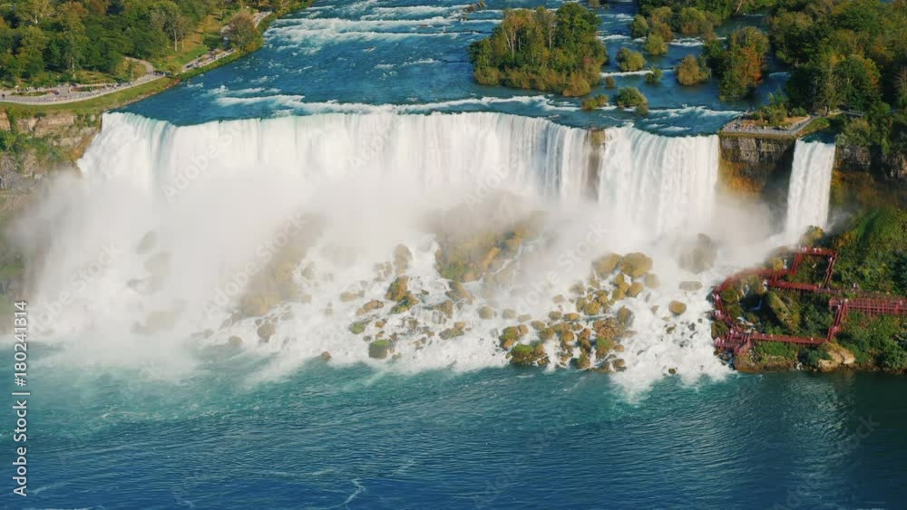 The view from above is the incredible Niagara Falls. View of the Niagara River and American Falls The view from above is the incredible Niagara Falls. View of the Niagara River and American Falls
