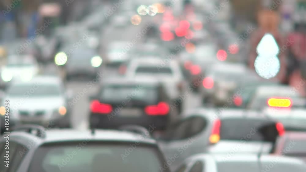 Dense traffic on the city road in the evening. Defocus Dense traffic on the city road in the evening. Defocus