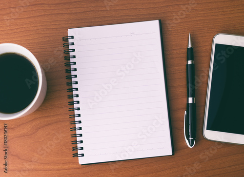 Blank Open Notepad With Coffee  Pen and Smart Phone.